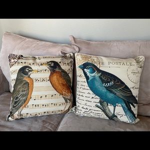 Two decorative bird print throw pillows